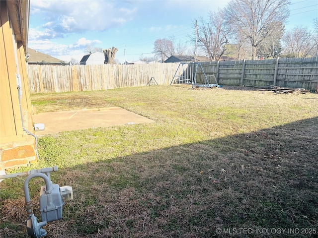 view of yard with a patio area and a fenced backyard