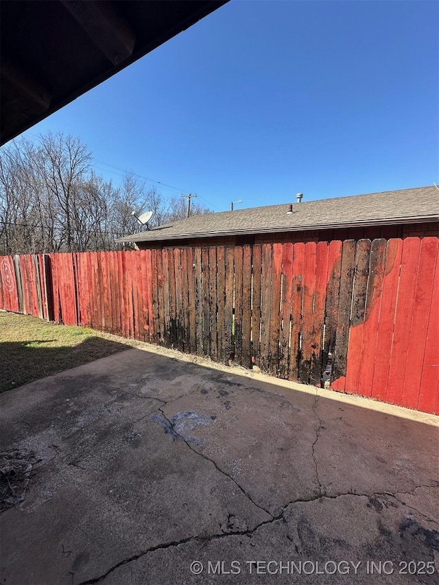 view of yard featuring a patio area and fence