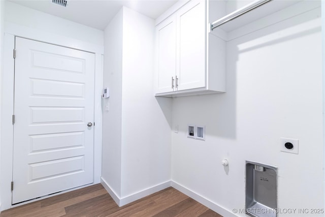 washroom featuring hookup for a washing machine, hookup for an electric dryer, gas dryer hookup, wood finished floors, and baseboards