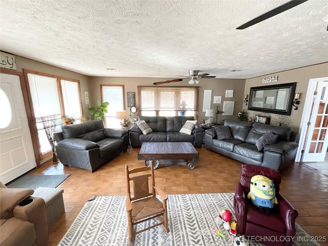 living area with a textured ceiling