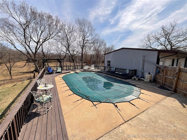 view of pool featuring a deck and a fenced in pool