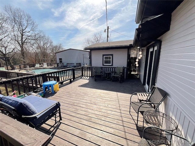 deck with a fenced in pool