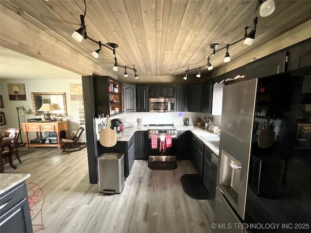 kitchen with wood ceiling, light countertops, appliances with stainless steel finishes, and light wood-style flooring