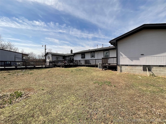 view of yard with a wooden deck