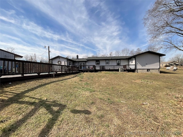 back of property with a wooden deck