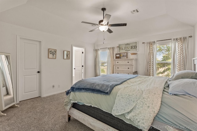 bedroom featuring carpet floors, lofted ceiling, visible vents, a ceiling fan, and baseboards