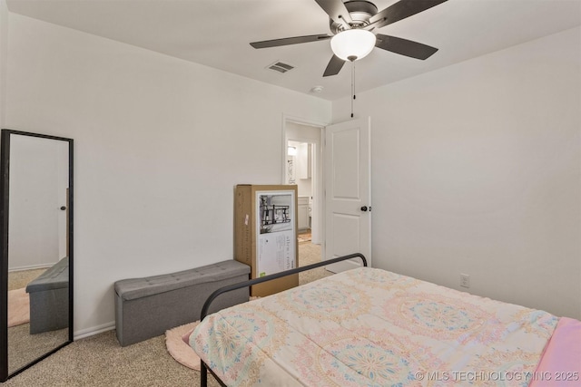 carpeted bedroom with visible vents and ceiling fan