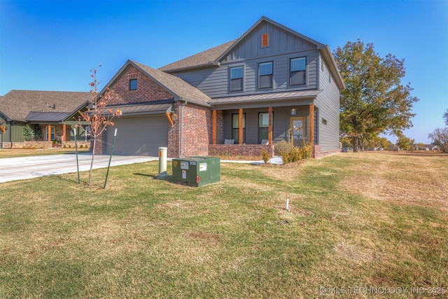 view of front facade with a garage, a front lawn, board and batten siding, and brick siding