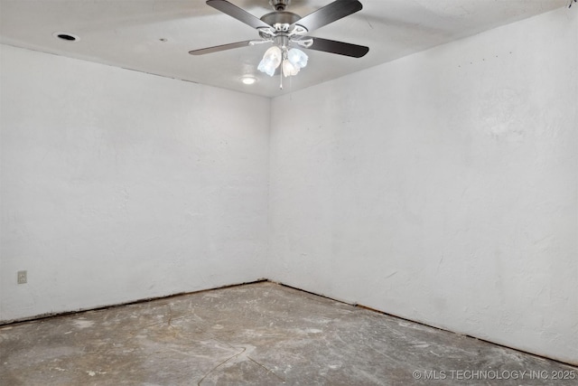 unfurnished room featuring concrete floors