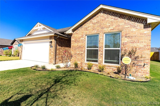 ranch-style home featuring a garage, driveway, brick siding, and a front yard