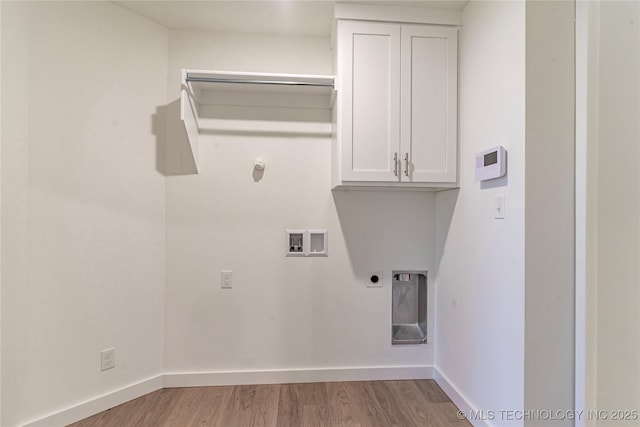 laundry area featuring washer hookup, cabinet space, electric dryer hookup, wood finished floors, and baseboards