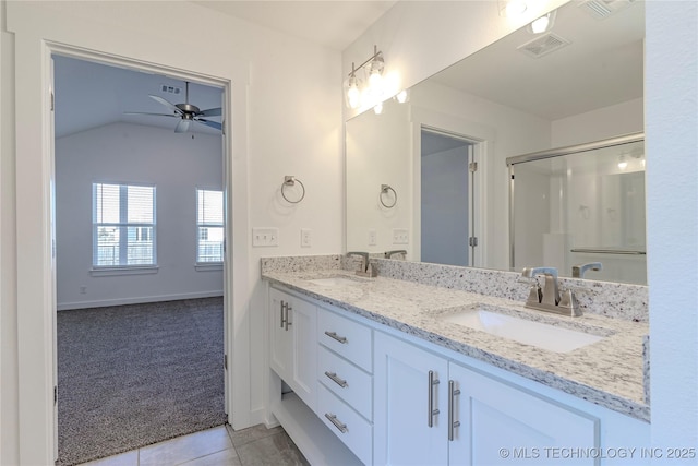 bathroom with double vanity, tile patterned flooring, a sink, and visible vents