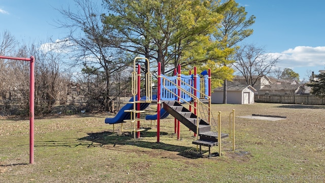 community jungle gym with a lawn, an outdoor structure, and fence