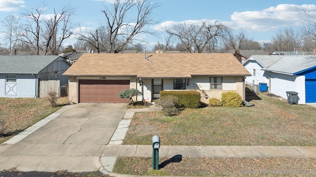 ranch-style home with an attached garage, fence, concrete driveway, and brick siding