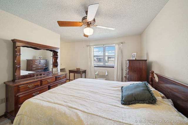 bedroom featuring a textured ceiling and a ceiling fan