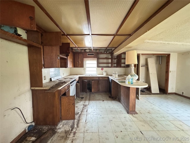 kitchen with open shelves, a sink, a peninsula, baseboards, and white gas range oven