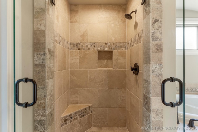 full bathroom featuring a shower stall