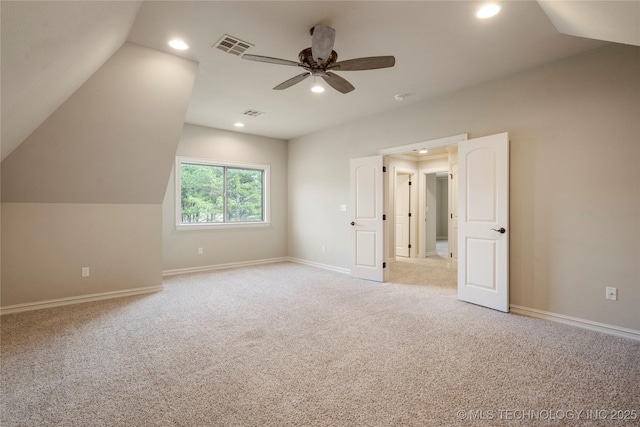 bonus room featuring recessed lighting, visible vents, light carpet, vaulted ceiling, and baseboards