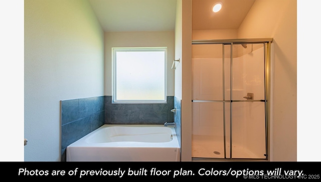 bathroom with a shower stall and a bath