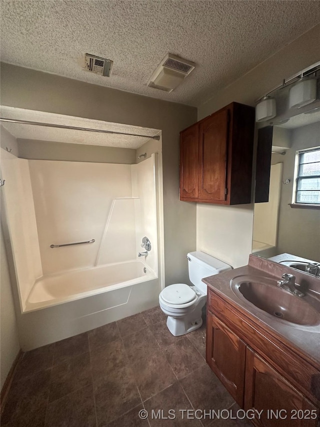 bathroom featuring toilet, visible vents, tub / shower combination, and vanity