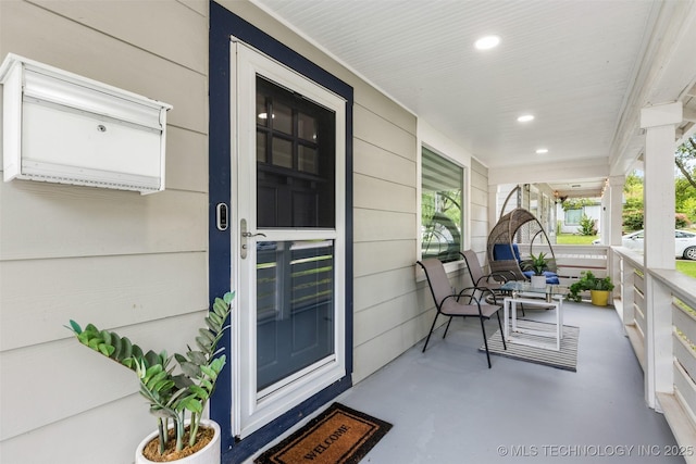 entrance to property featuring a porch