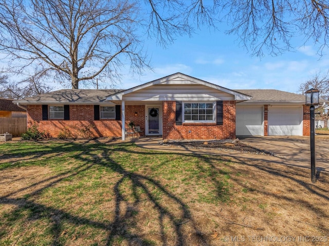 ranch-style home featuring driveway, fence, a front yard, a garage, and brick siding