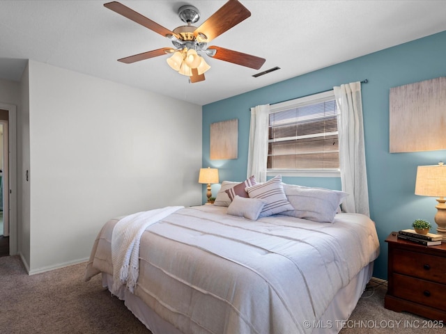 bedroom featuring ceiling fan, carpet, visible vents, and baseboards