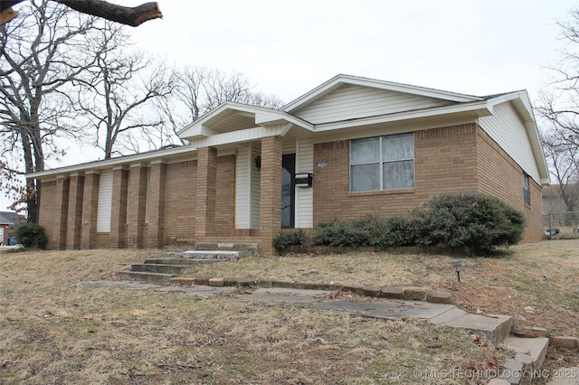 view of front of home featuring brick siding