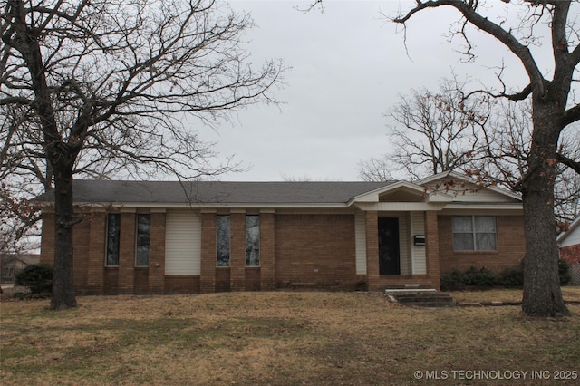 ranch-style home with brick siding and a front lawn