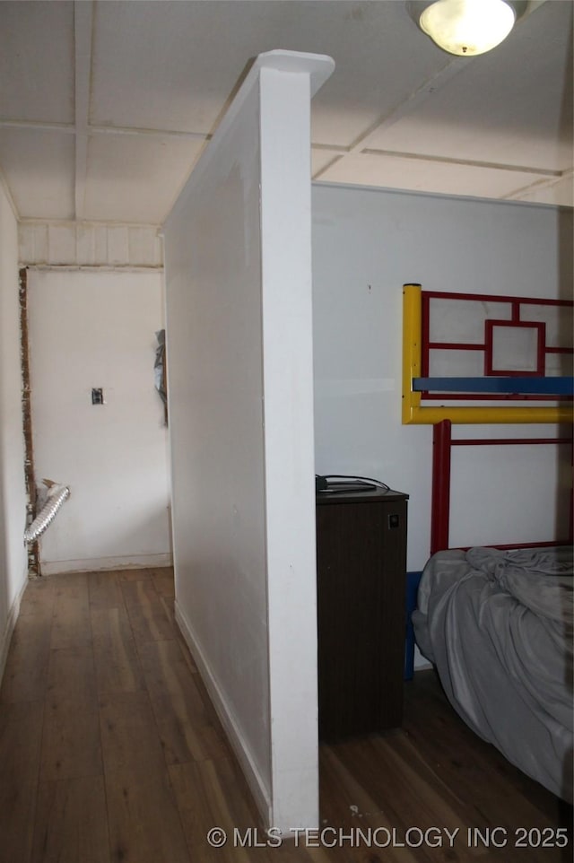 corridor with hardwood / wood-style floors