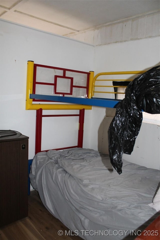 bedroom with wood finished floors