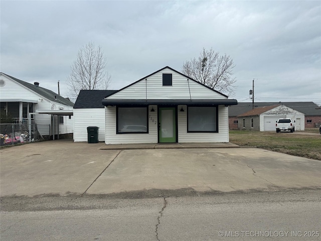 view of front of home featuring roof with shingles