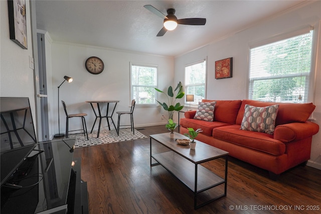 living room with baseboards, ceiling fan, ornamental molding, and dark wood-style flooring