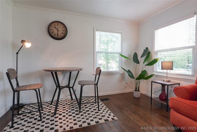 office with a wealth of natural light, baseboards, crown molding, and wood finished floors