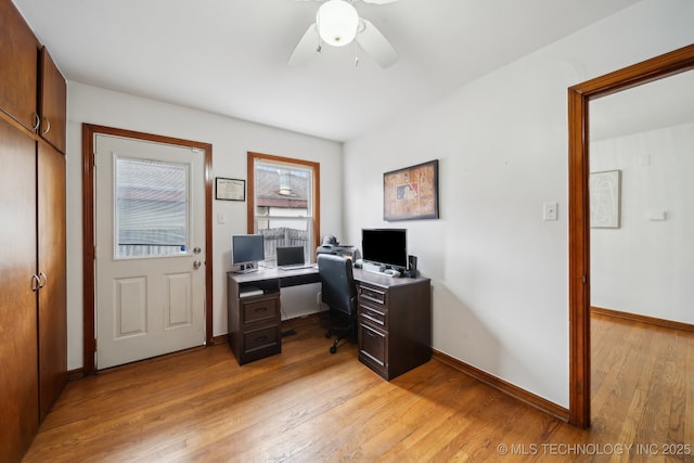 office area featuring ceiling fan, baseboards, and light wood-style floors