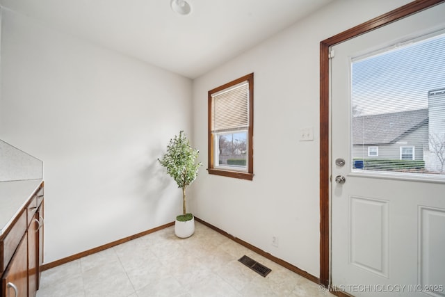 entryway with visible vents and baseboards