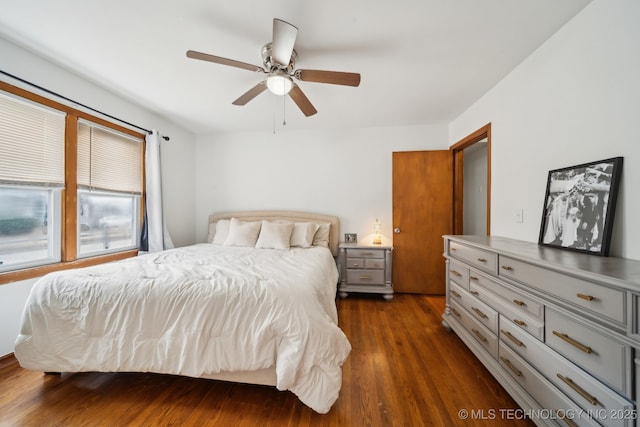 bedroom featuring dark wood finished floors and a ceiling fan