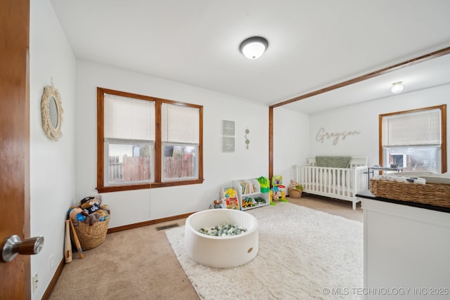 bedroom featuring carpet flooring, visible vents, and baseboards