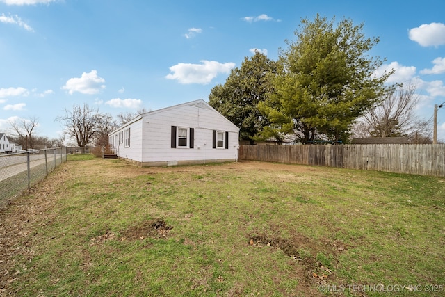 view of home's exterior featuring a yard and a fenced backyard