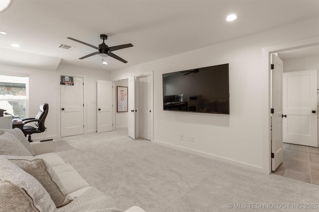 living room featuring baseboards, visible vents, and light colored carpet