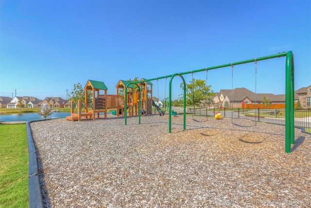 community play area with a residential view and fence