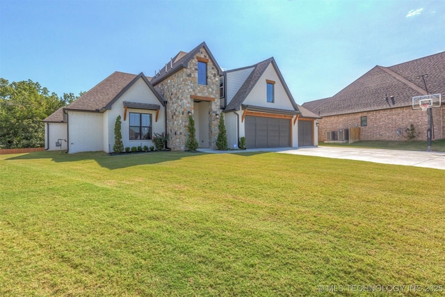 view of front facade with an attached garage, stone siding, a front yard, and driveway