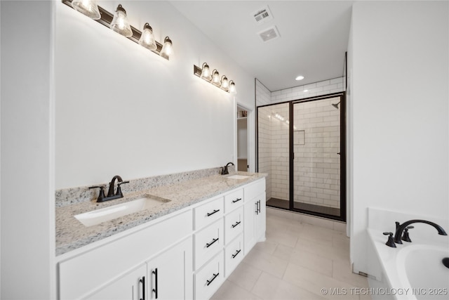 full bathroom featuring a bath, a sink, visible vents, and a shower stall