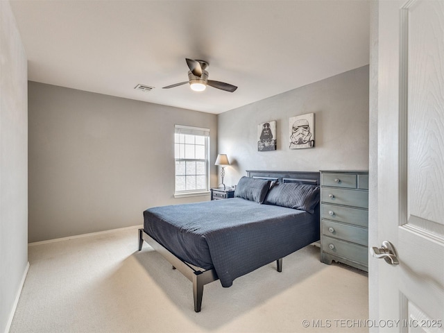 bedroom featuring light carpet, ceiling fan, visible vents, and baseboards