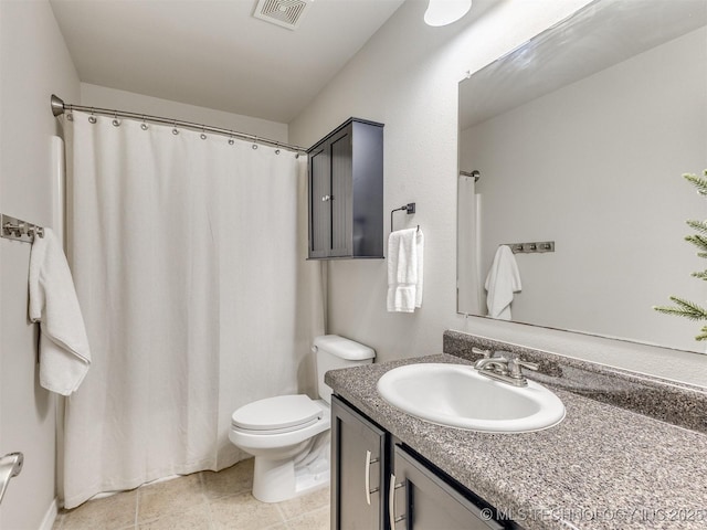 bathroom featuring tile patterned flooring, toilet, a shower with shower curtain, vanity, and visible vents