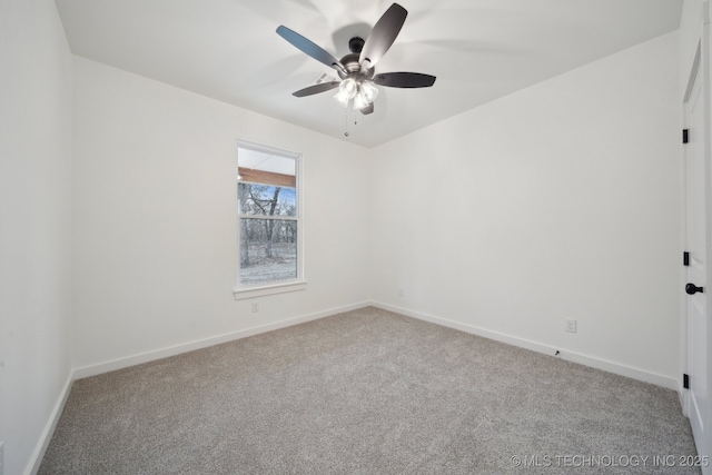 empty room featuring carpet, baseboards, and ceiling fan