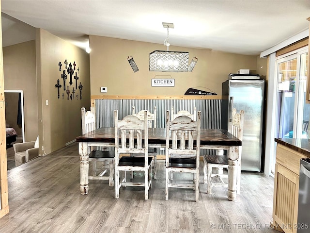 dining area featuring light wood-style flooring