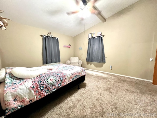 carpeted bedroom featuring vaulted ceiling, ceiling fan, and baseboards