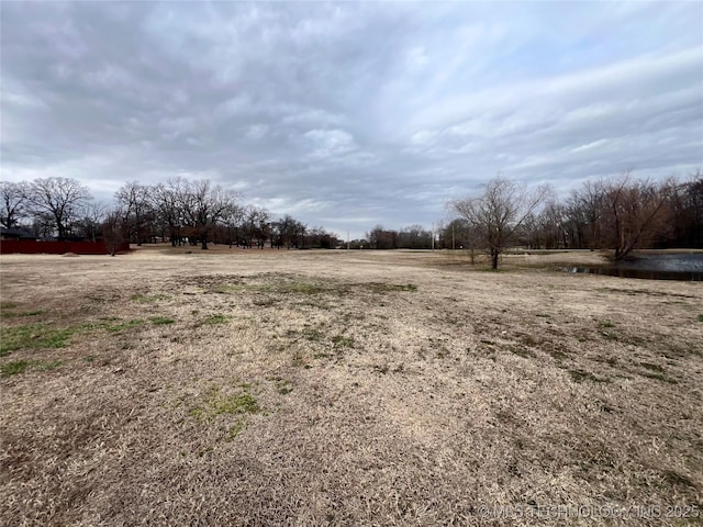 view of yard with a rural view