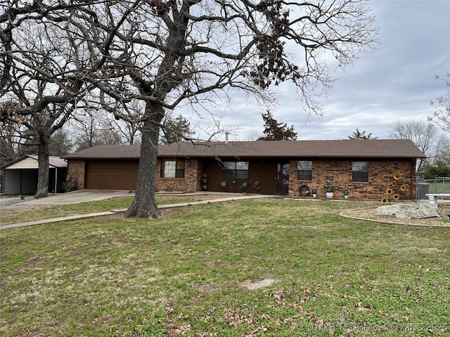 ranch-style home featuring central AC unit, a garage, brick siding, driveway, and a front yard